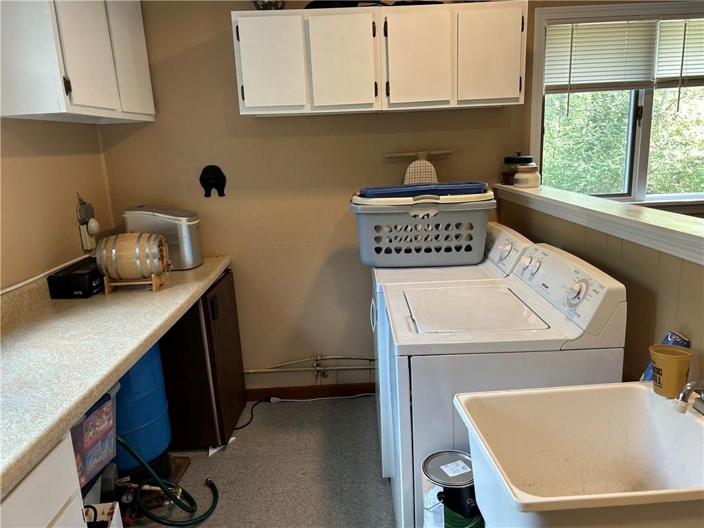 240 Martin Road Scottdale, PA 15683 - Photo 10 of 16 a utility room with sink dryer and washer