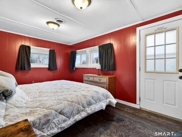 a bed sitting in a bedroom next to a closet