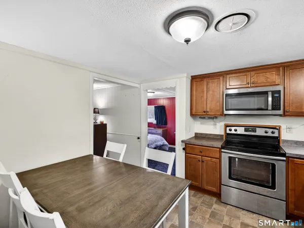 a dinning room with furniture and wooden floor
