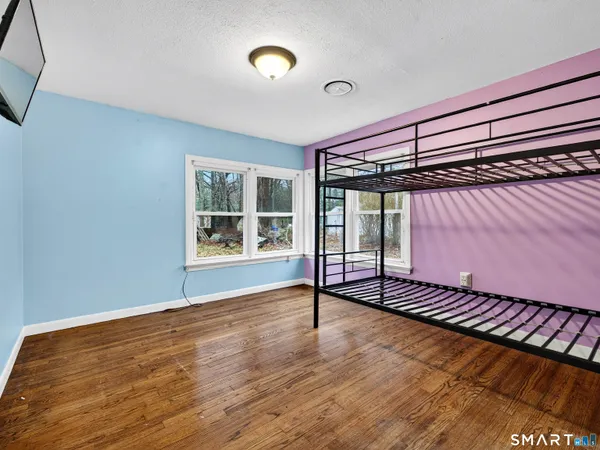 a view of livingroom with furniture wooden floor and window