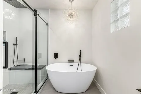 a bathroom with a bathtub and shower