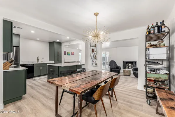 a kitchen with a table and chairs in it