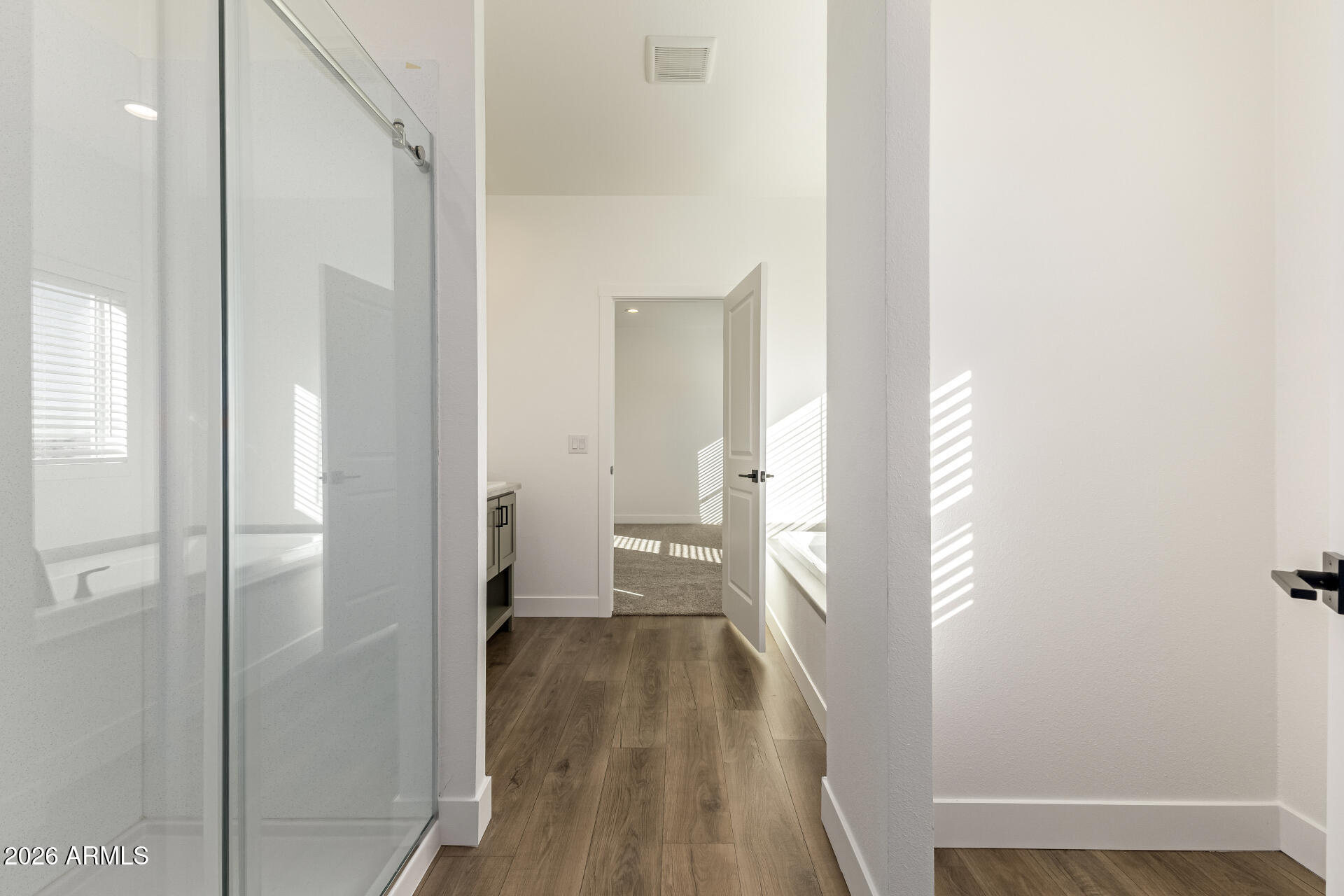 23059 West Rancho Laredo Drive Wittmann, AZ 85361 - Photo 12 of 29 a view of a bathroom from a hallway