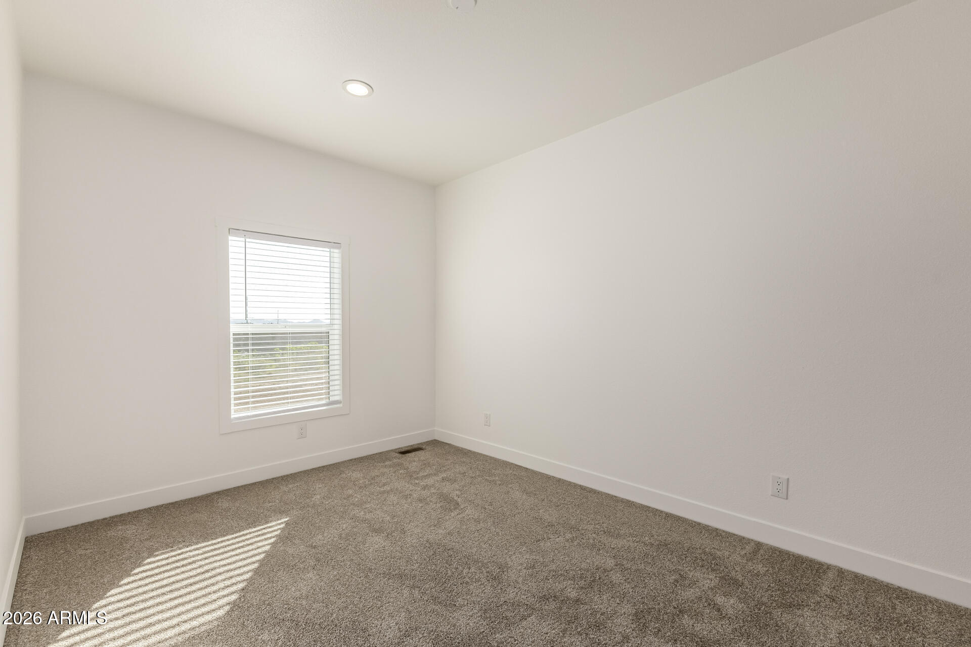 23059 West Rancho Laredo Drive Wittmann, AZ 85361 - Photo 17 of 29 an empty room with a window