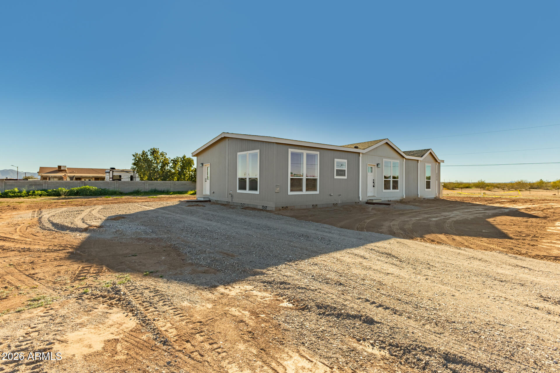 23059 West Rancho Laredo Drive Wittmann, AZ 85361 - Photo 2 of 29 a view of house with yard and lake view