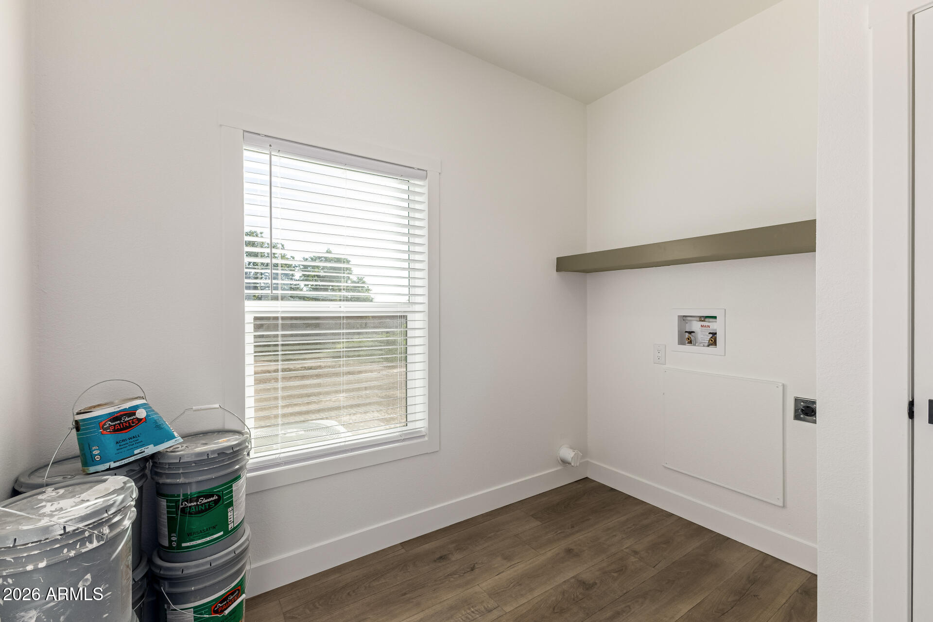 23059 West Rancho Laredo Drive Wittmann, AZ 85361 - Photo 26 of 29 a room with a window and flowerpot