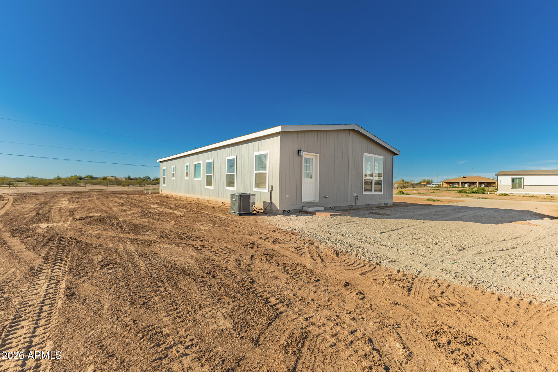 23059 West Rancho Laredo Drive Wittmann, AZ 85361 - Photo 27 of 29 a view of a house with a snow in the background