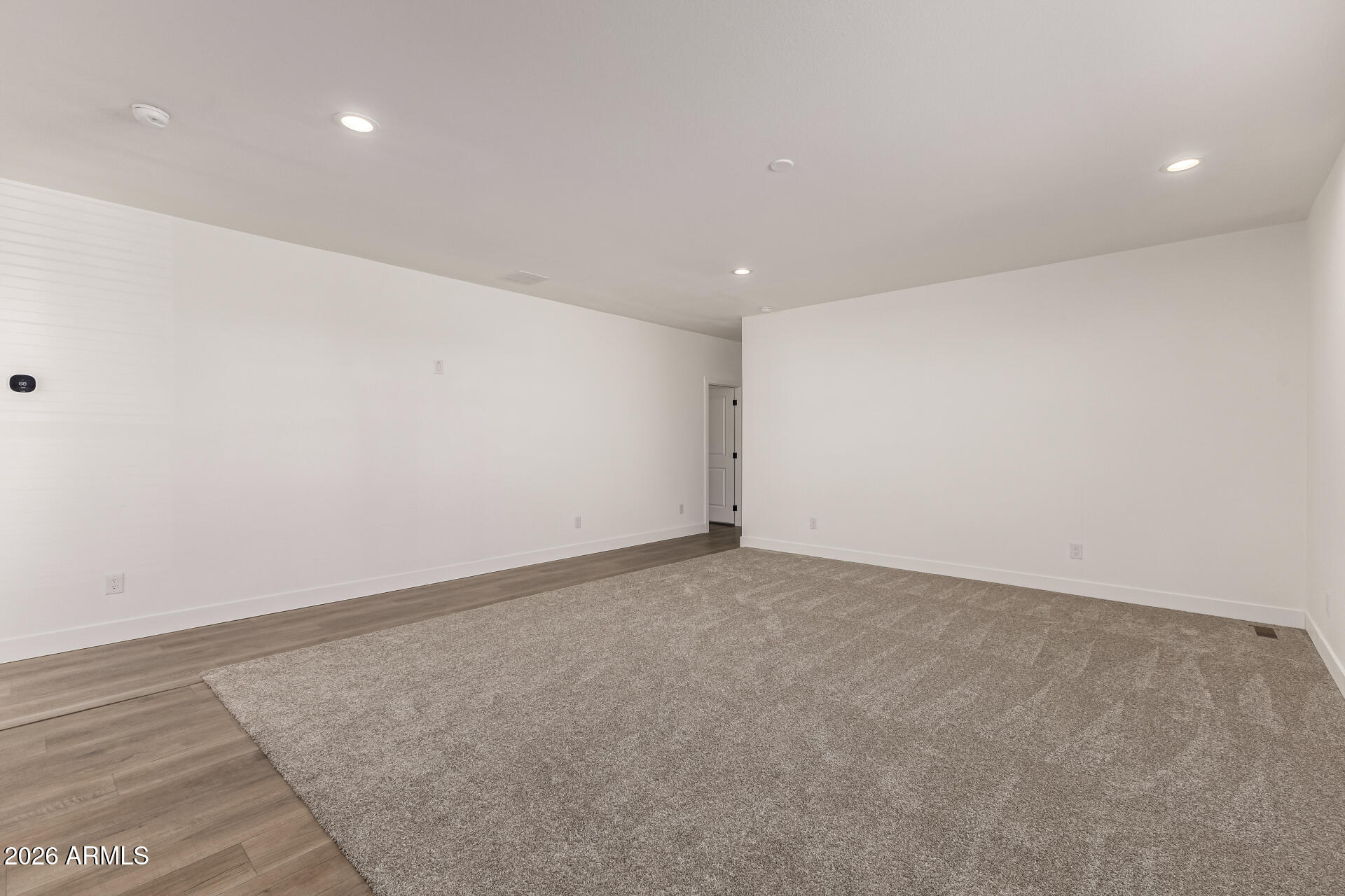 23059 West Rancho Laredo Drive Wittmann, AZ 85361 - Photo 8 of 29 a view of an empty room