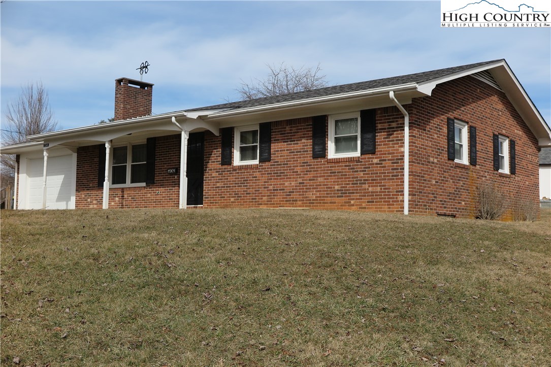 134 Carson Boulevard Sparta, NC 28675 - Photo 1 of 15 a front view of a house with yard