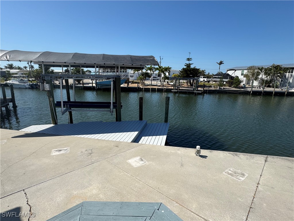3813 Dewberry Lane St. James City, FL 33956 - Photo 1 of 9 a view of a lake with boats