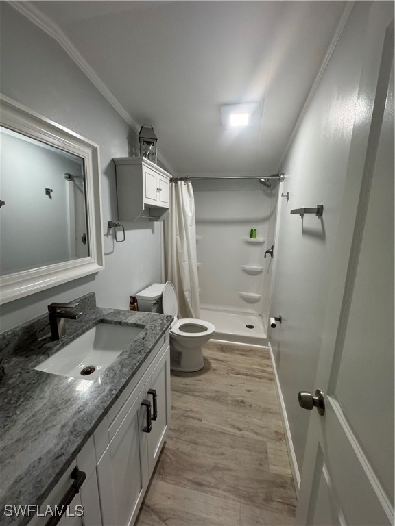 3813 Dewberry Lane St. James City, FL 33956 - Photo 7 of 9 a bathroom with a granite countertop sink toilet and shower