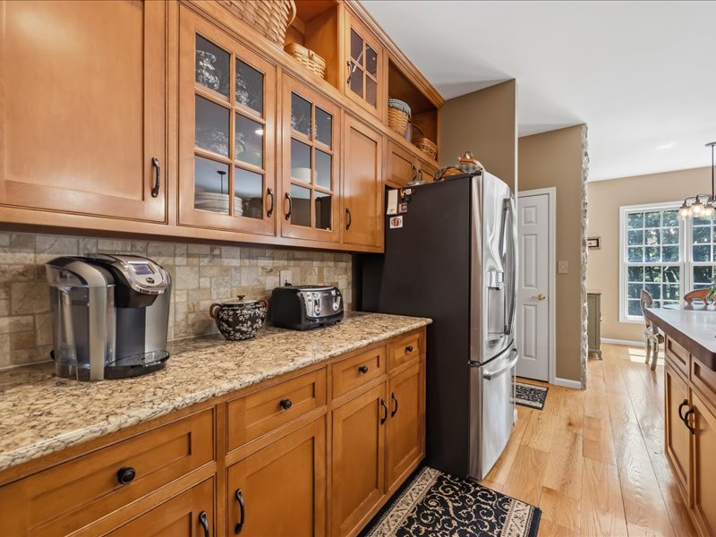 1168 Mt Pleasant Road Bangor, PA 18013 - Photo 31 of 100 Rich wood cabinetry paired with granite countertops creates a warm, classic kitchen space.
