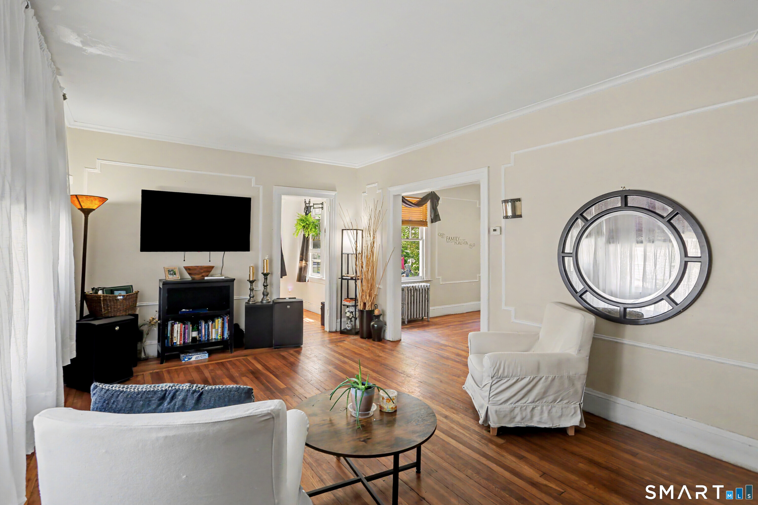 94 2nd Street Hamden, CT 06514 - Photo 5 of 31 a living room with fireplace furniture and a flat screen tv