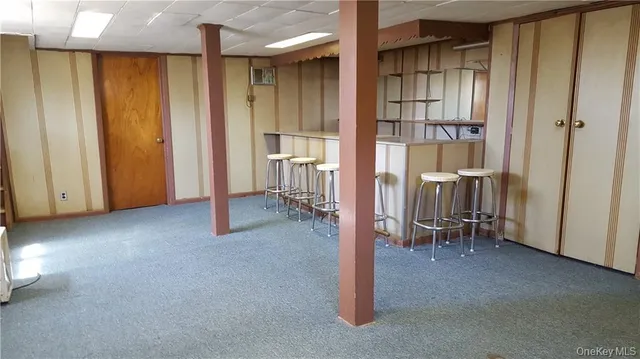 a view of an empty room with a fireplace