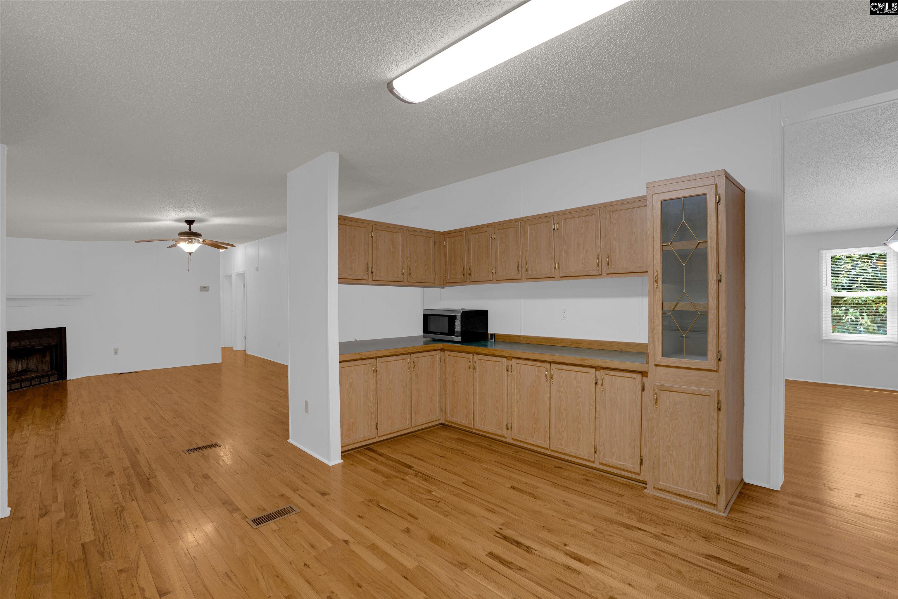 304 Cooper Road Blythewood, SC 29016 - Photo 8 of 29 a kitchen with stainless steel appliances a refrigerator and a stove top oven