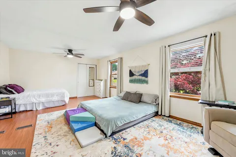 a bedroom with a large bed and a couch