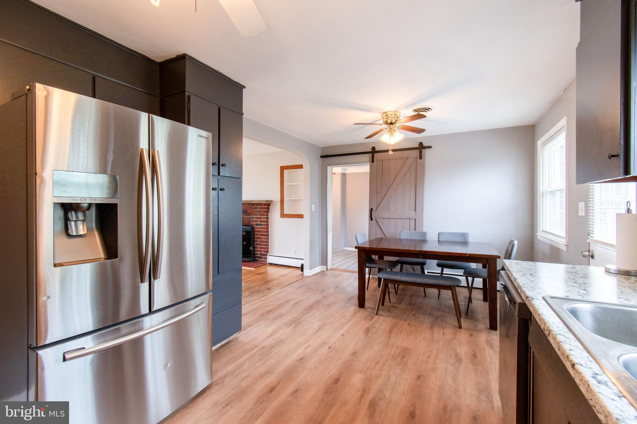 3911 Sunset Drive Hampstead, MD 21074 - Photo 17 of 38 a kitchen with stainless steel appliances a refrigerator a sink dishwasher a stove and a refrigerator