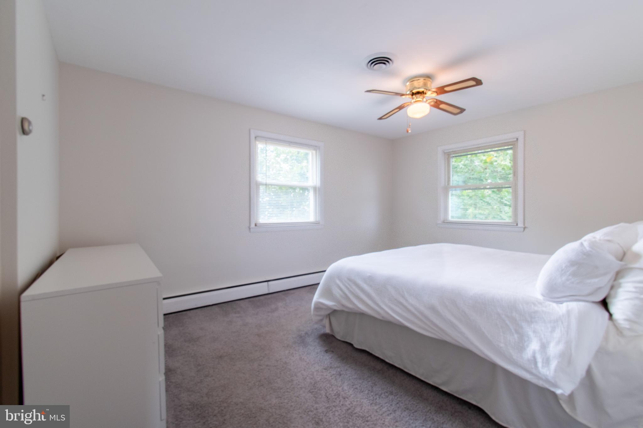 3911 Sunset Drive Hampstead, MD 21074 - Photo 20 of 38 a bedroom with a bed and window