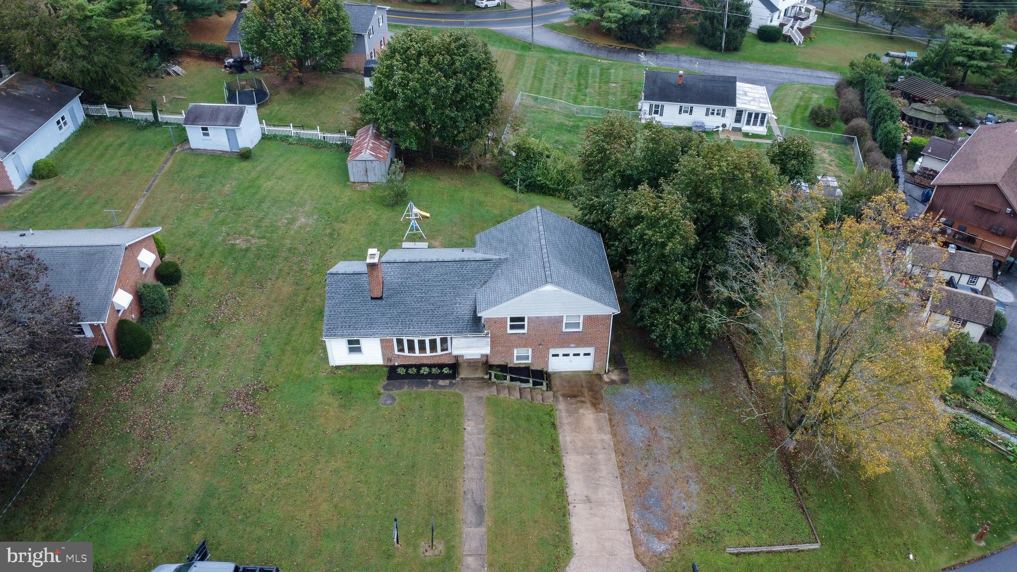 3911 Sunset Drive Hampstead, MD 21074 - Photo 2 of 38 an aerial view of a house with swimming pool and lake view