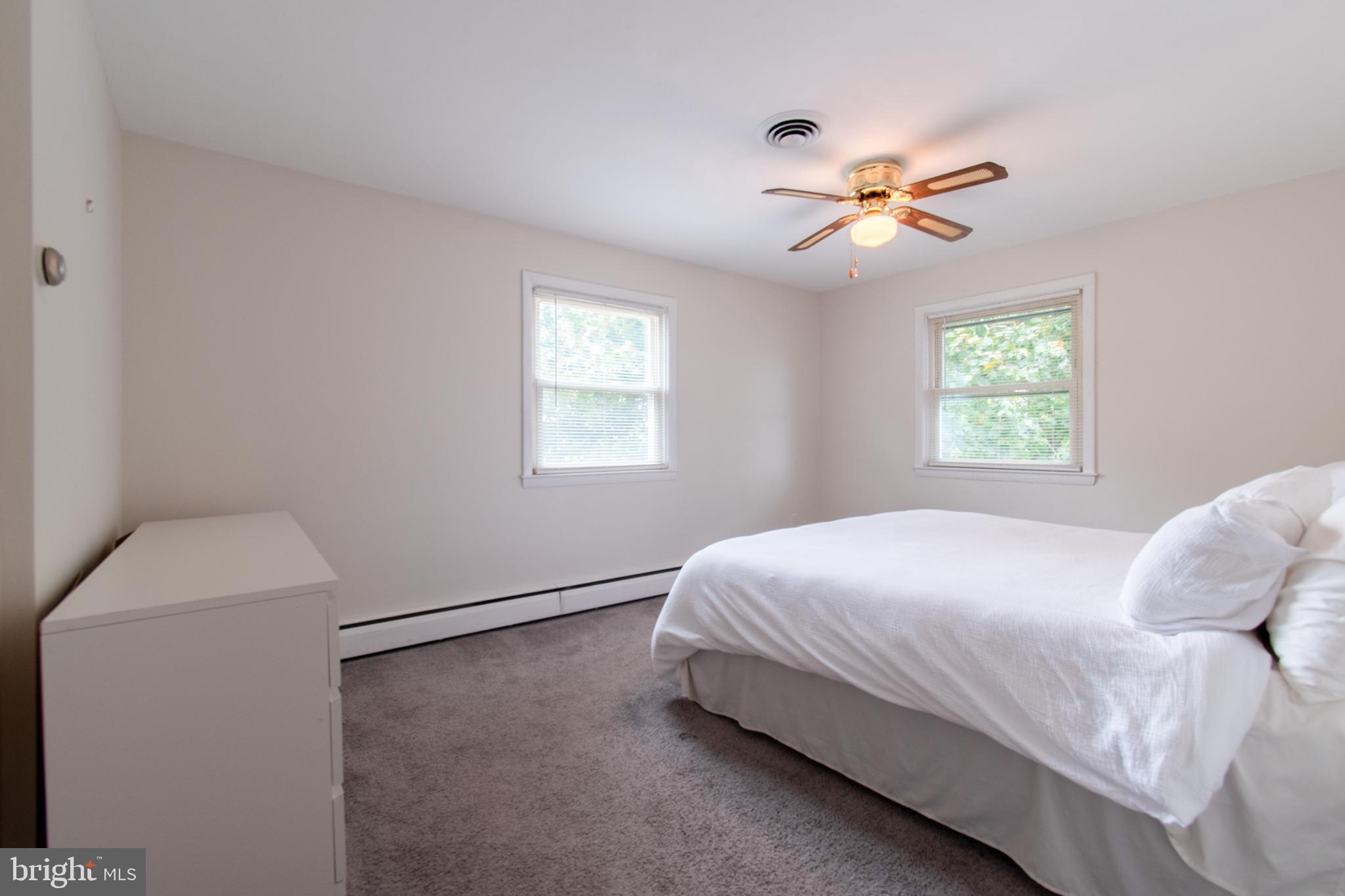 3911 Sunset Drive Hampstead, MD 21074 - Photo 22 of 38 a bedroom with a bed and a window