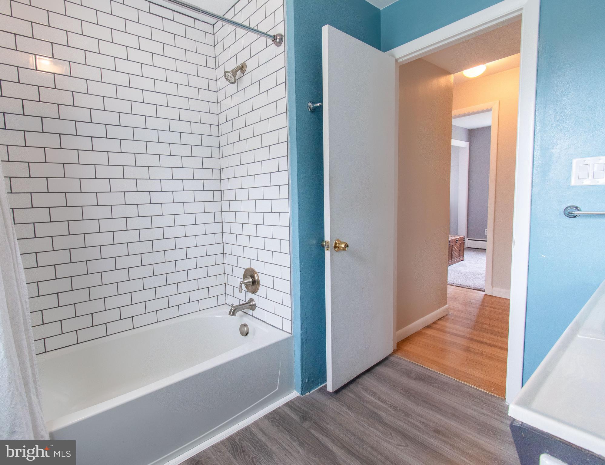 3911 Sunset Drive Hampstead, MD 21074 - Photo 23 of 38 a bathroom with a bathtub and shower