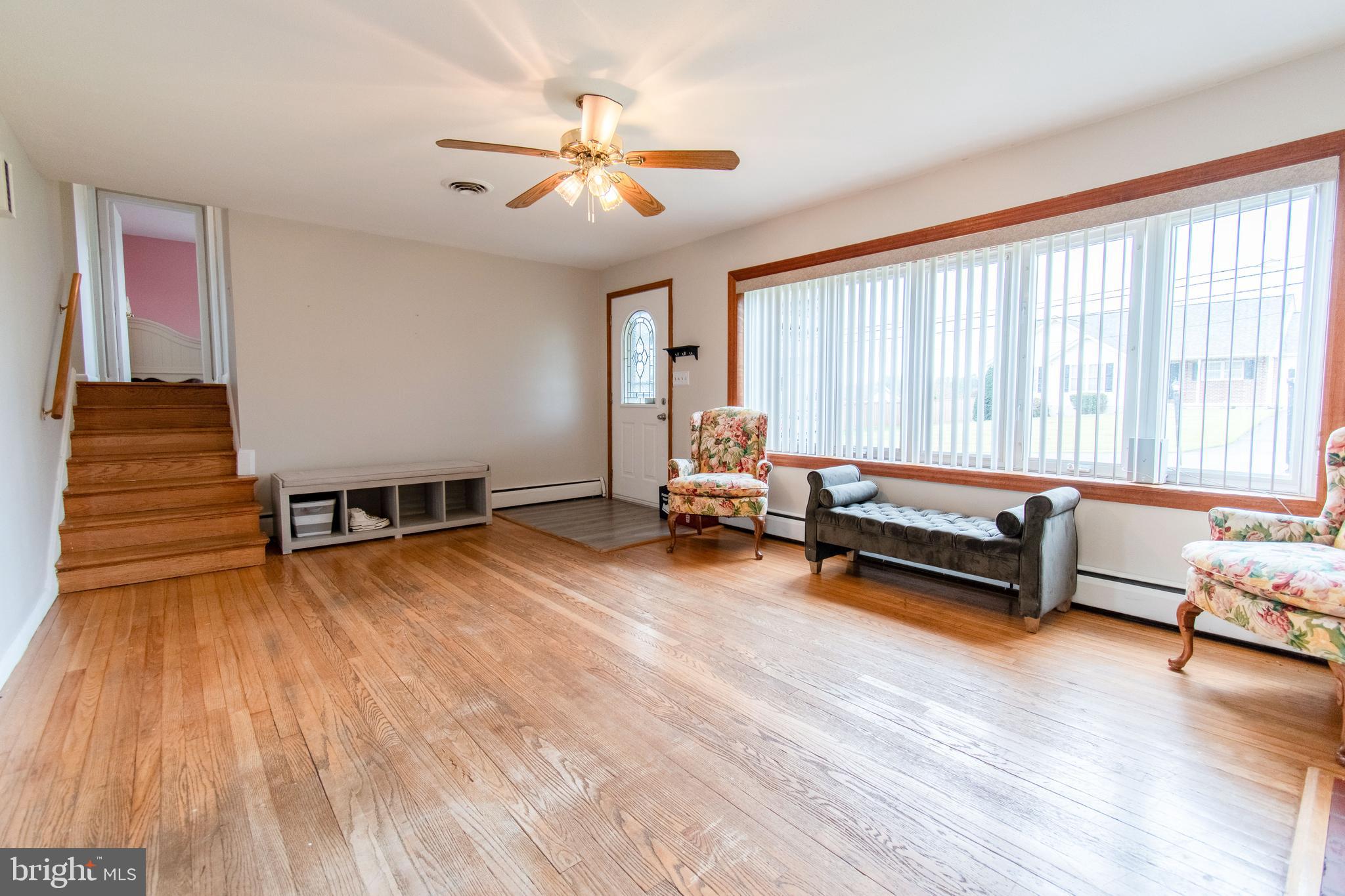 3911 Sunset Drive Hampstead, MD 21074 - Photo 3 of 38 a living room with furniture and wooden floor