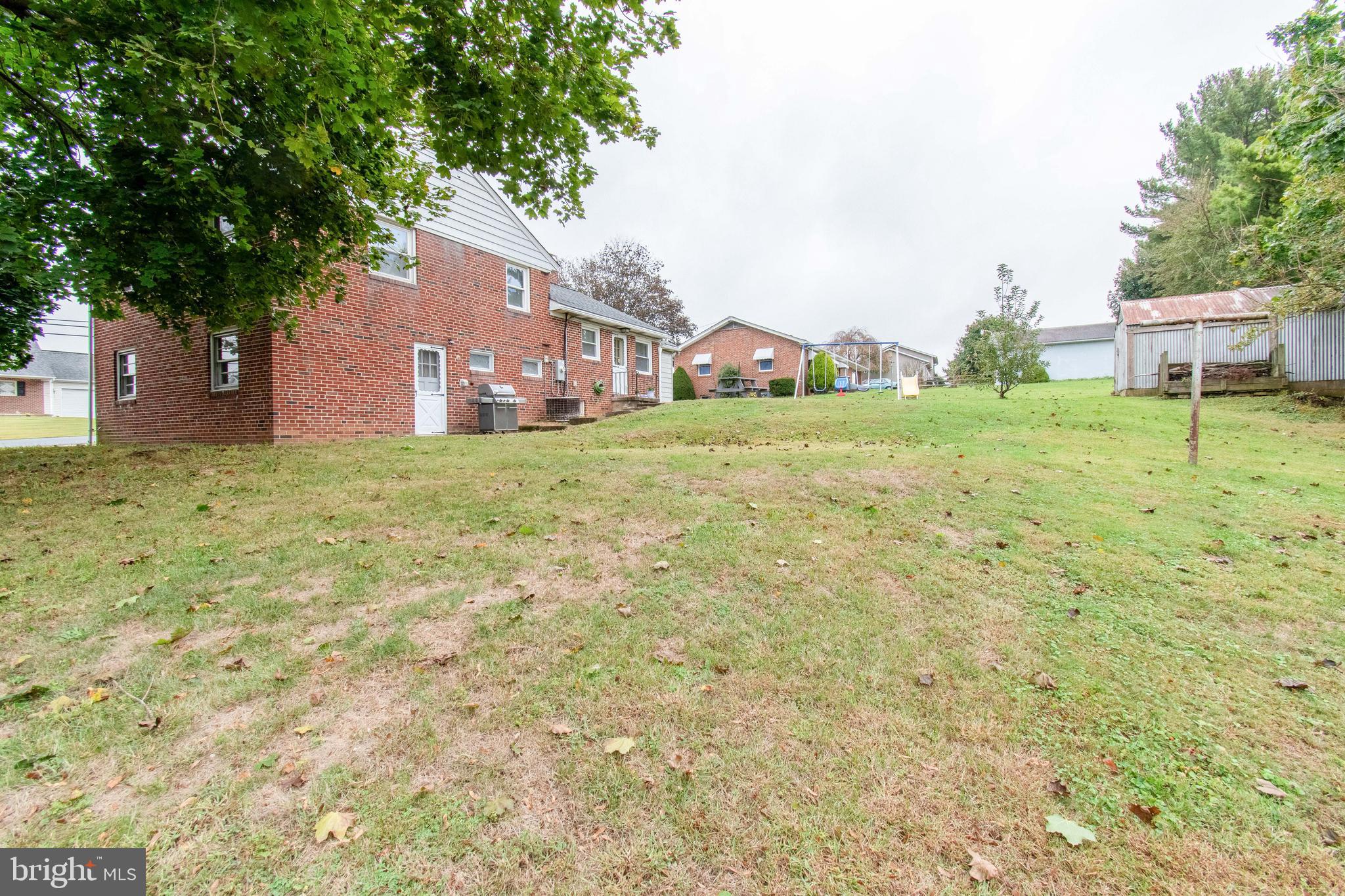 3911 Sunset Drive Hampstead, MD 21074 - Photo 34 of 38 a house that has a tree in front of it