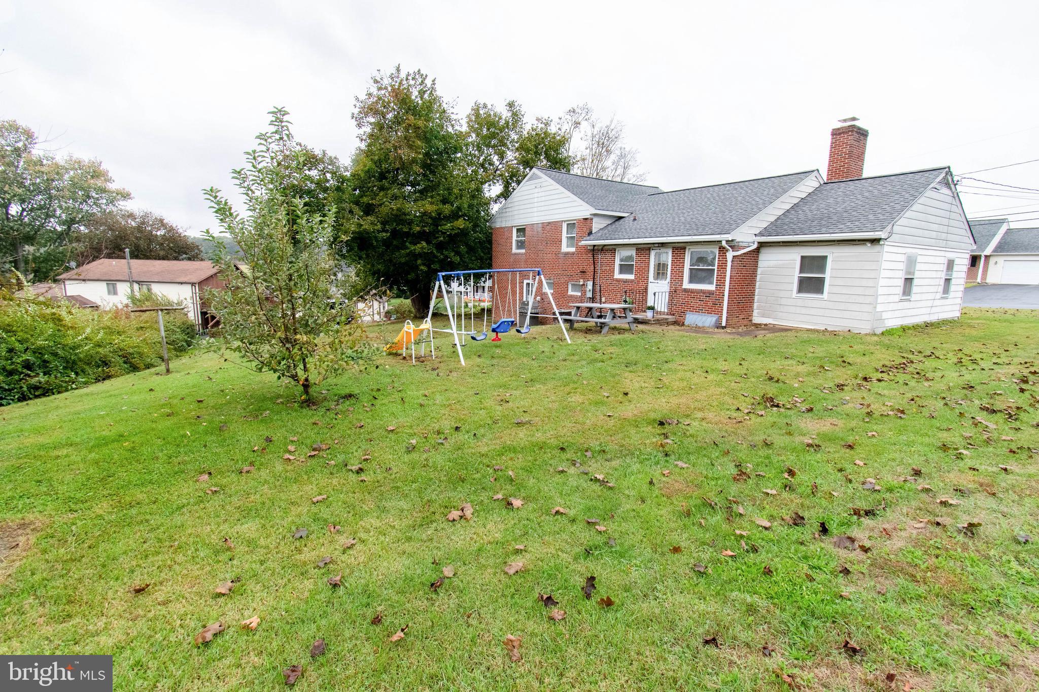 3911 Sunset Drive Hampstead, MD 21074 - Photo 35 of 38 a front of a house with a garden