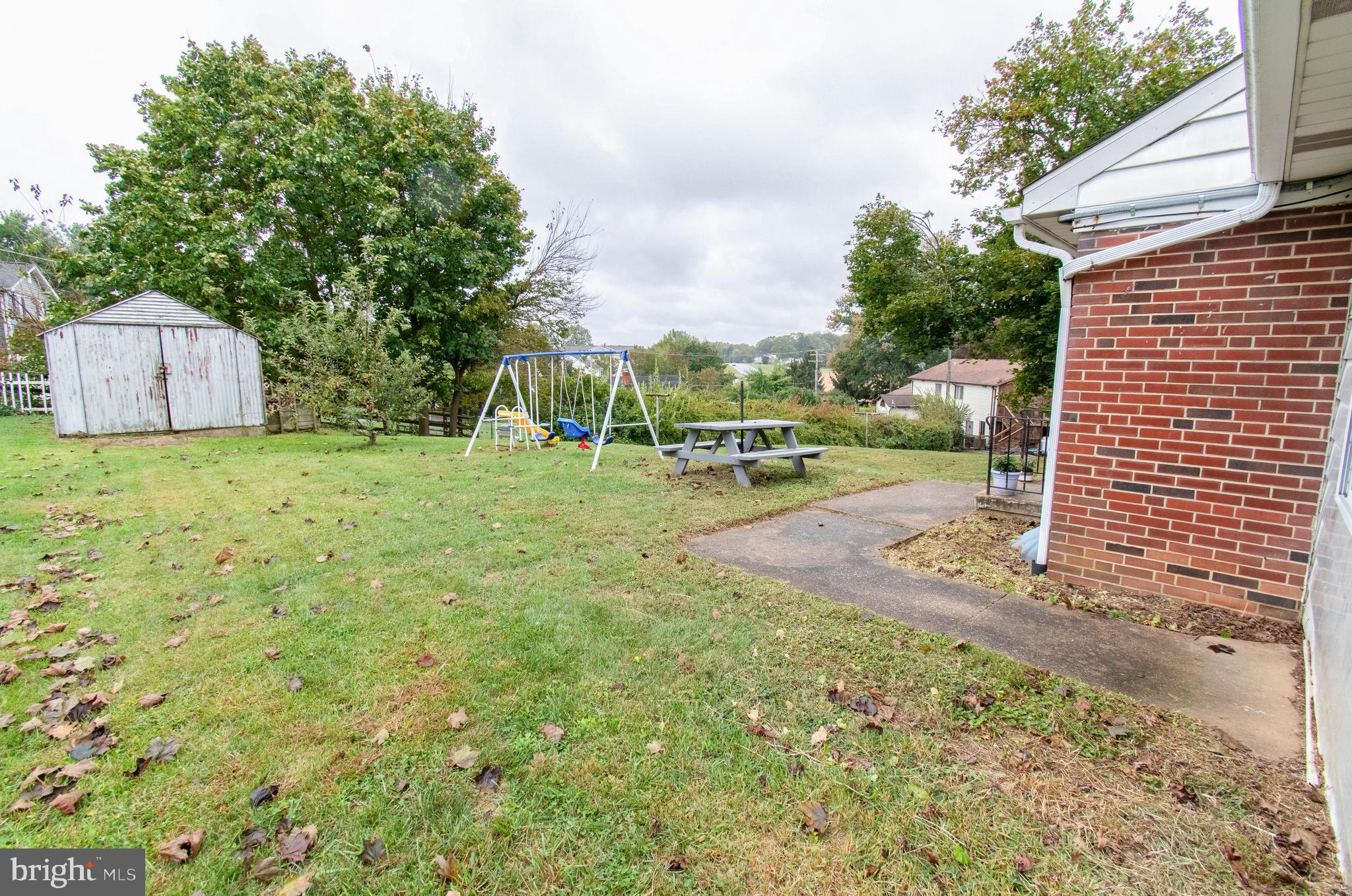 3911 Sunset Drive Hampstead, MD 21074 - Photo 36 of 38 a backyard of a house with table and chairs