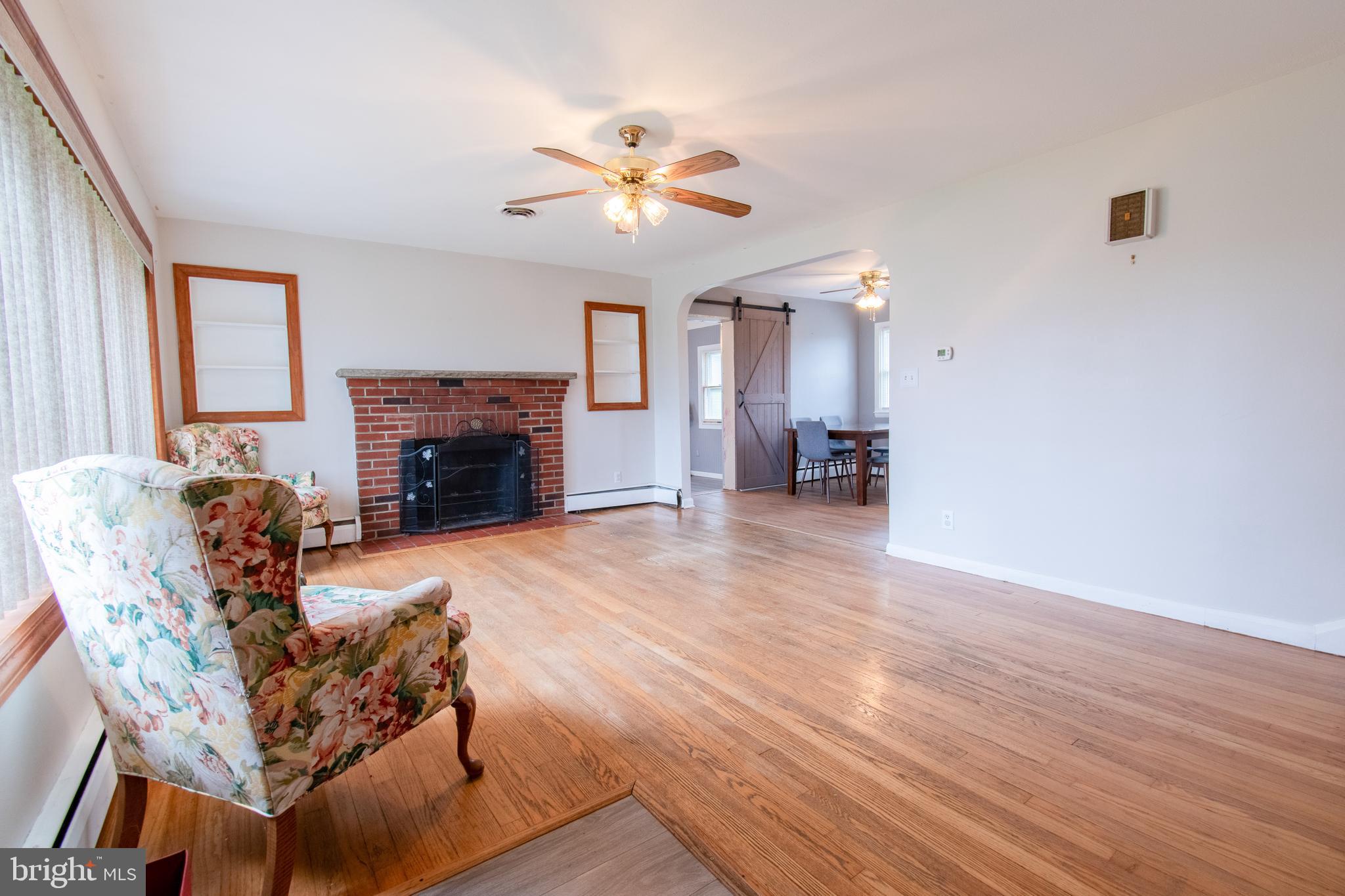 3911 Sunset Drive Hampstead, MD 21074 - Photo 4 of 38 a living room with furniture and a fireplace