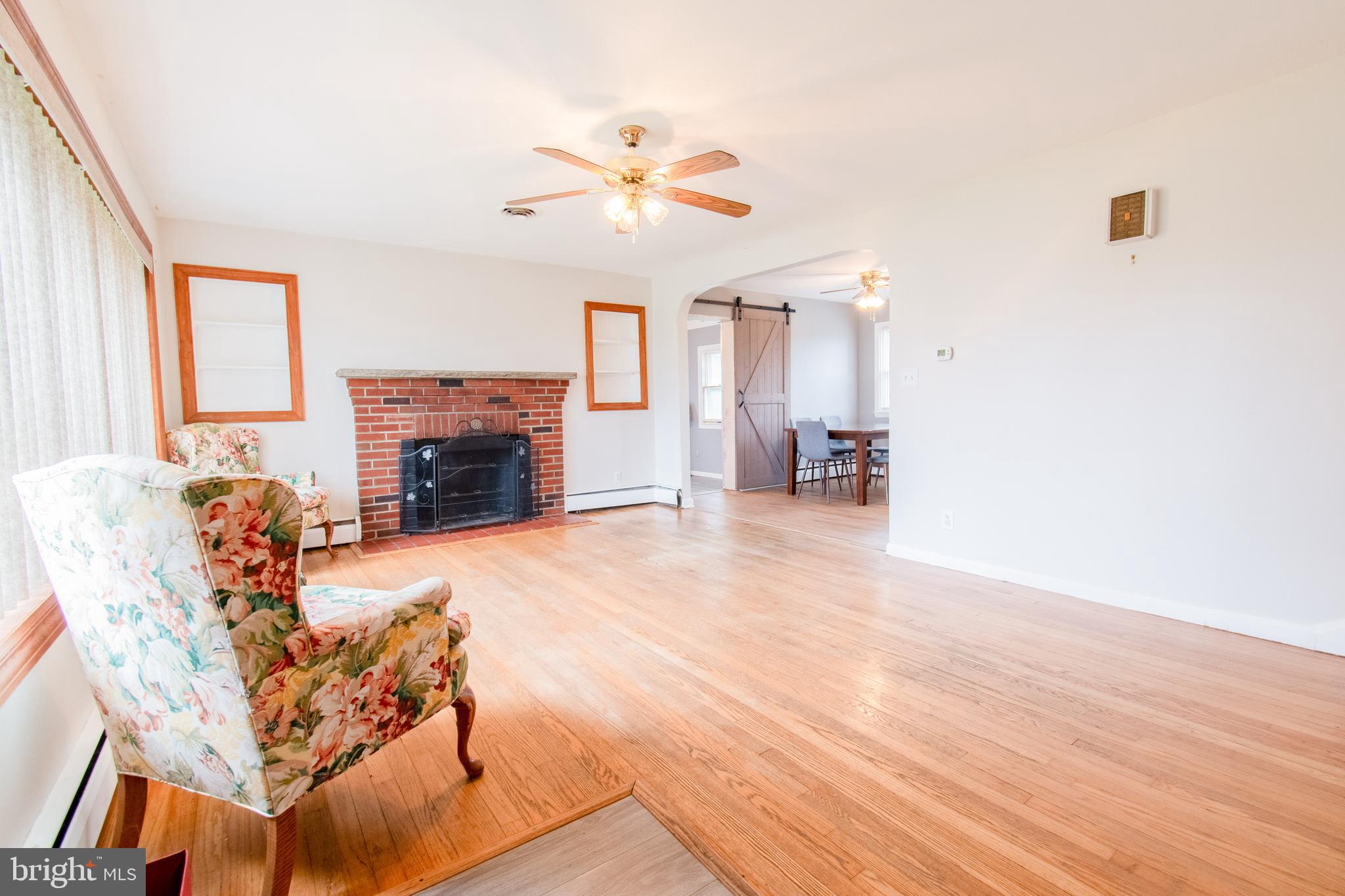 3911 Sunset Drive Hampstead, MD 21074 - Photo 6 of 38 a view of a livingroom with furniture and a fireplace