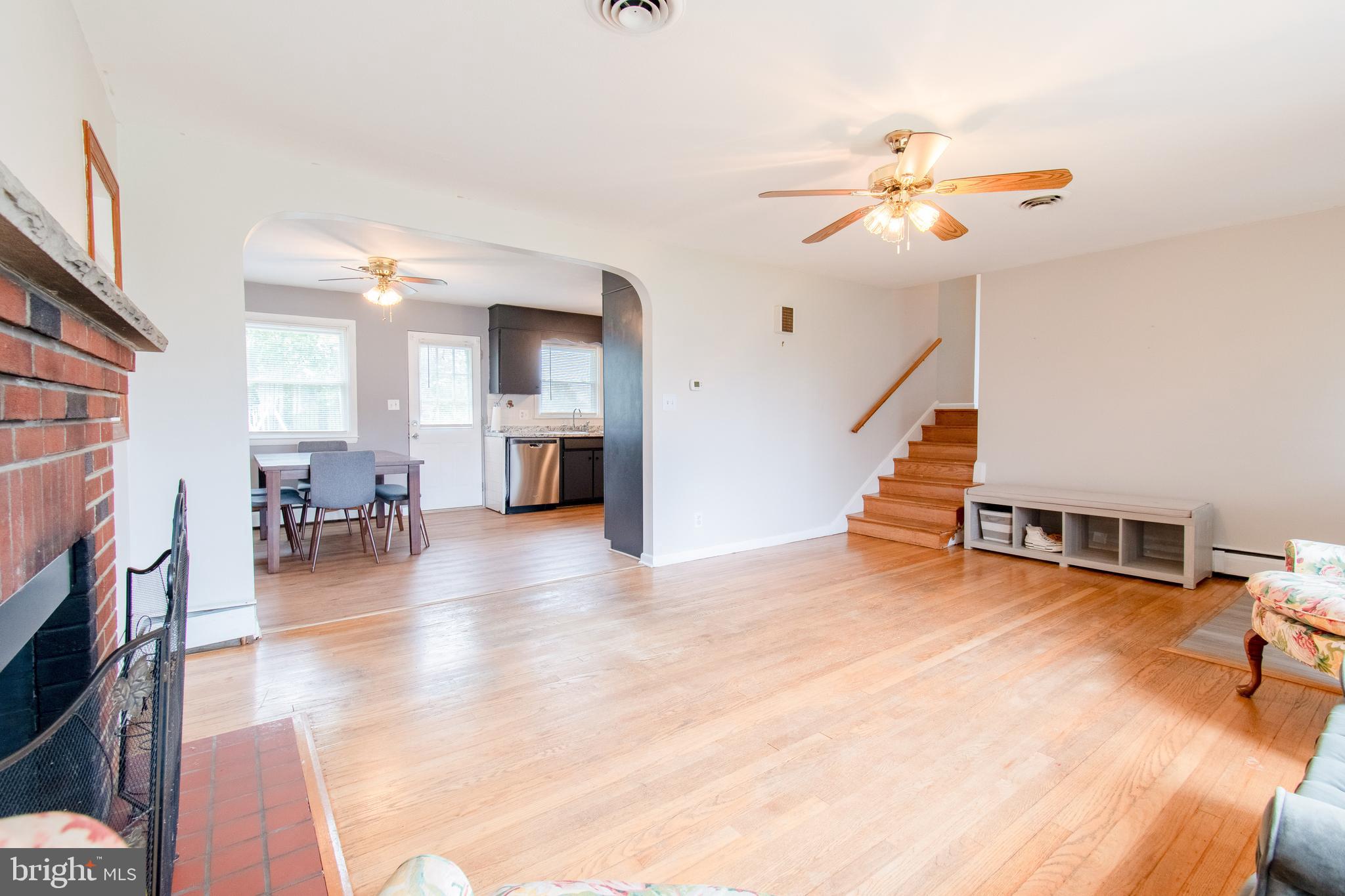 3911 Sunset Drive Hampstead, MD 21074 - Photo 8 of 38 a view of livingroom with dining room and wooden floor