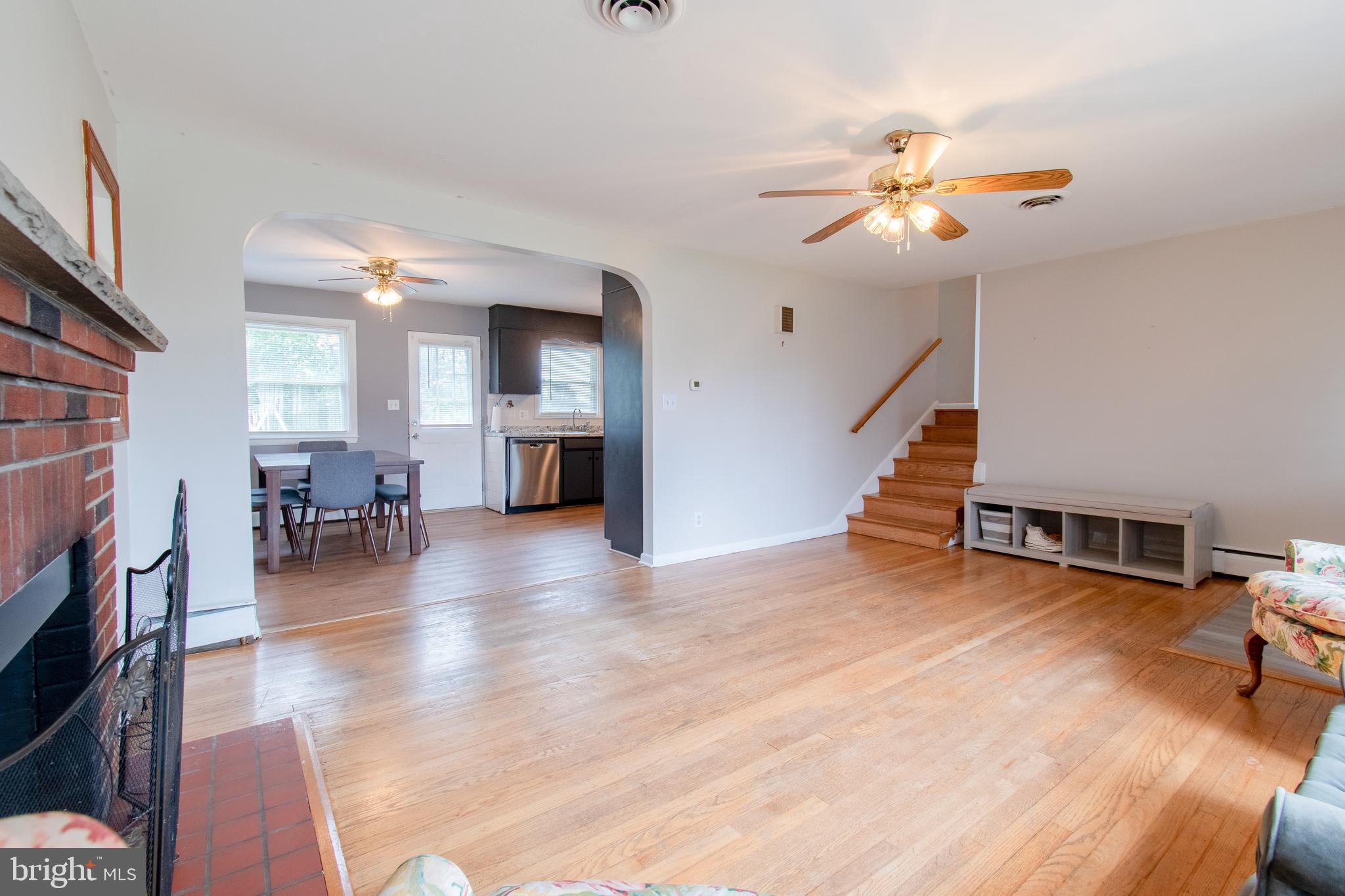 3911 Sunset Drive Hampstead, MD 21074 - Photo 10 of 38 a view of a livingroom with furniture and a ceiling fan