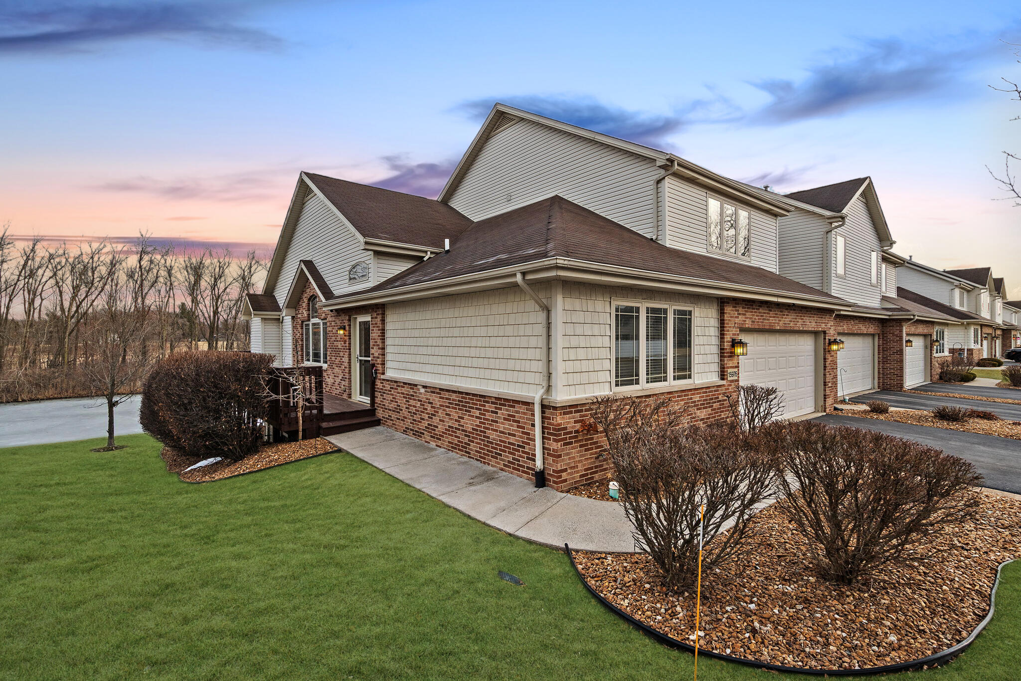 a view of a house with a backyard