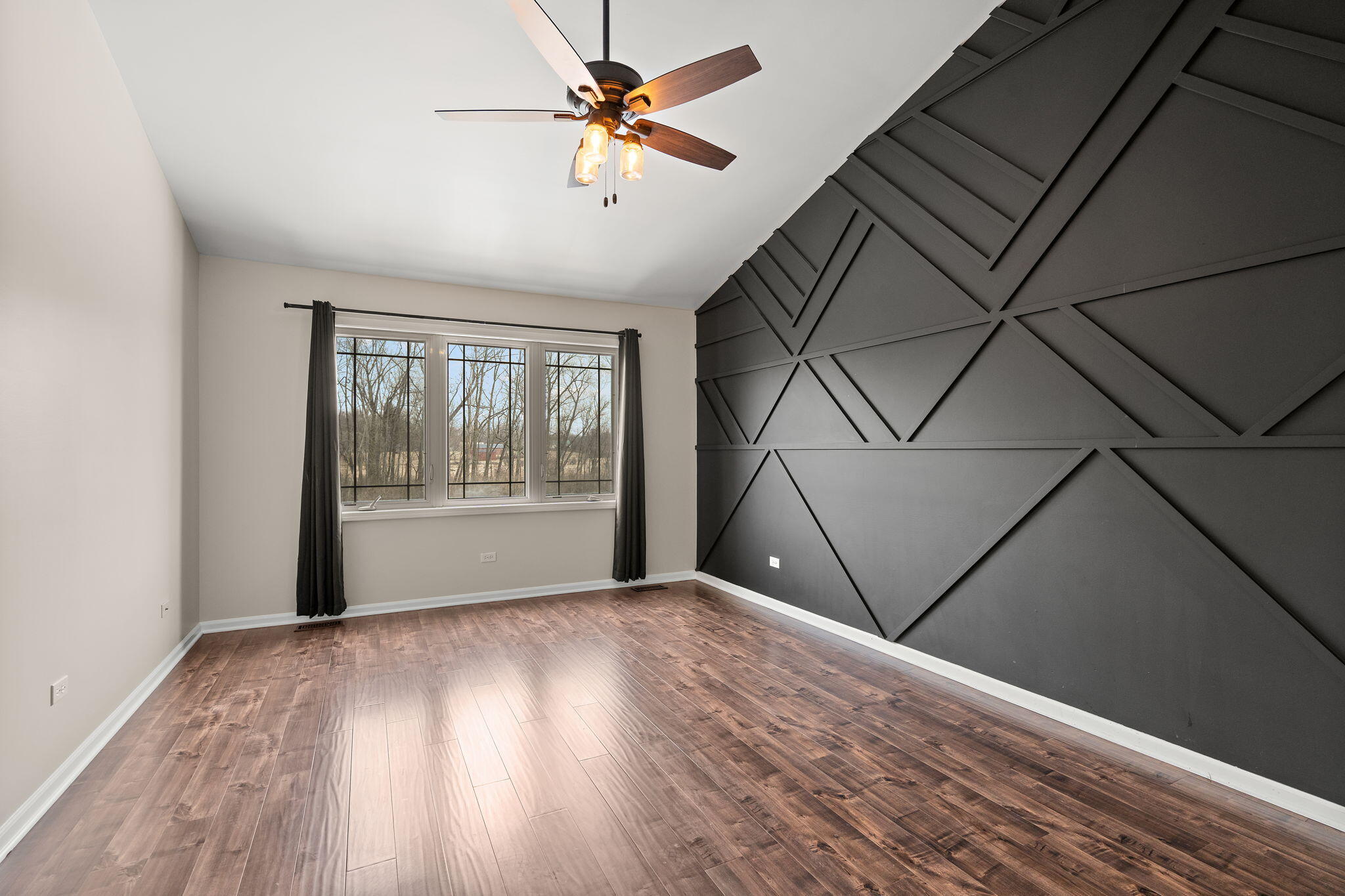 15976 97th Court Dyer, IN 46311 - Photo 11 of 29 a view of an empty room with a window and wooden floor
