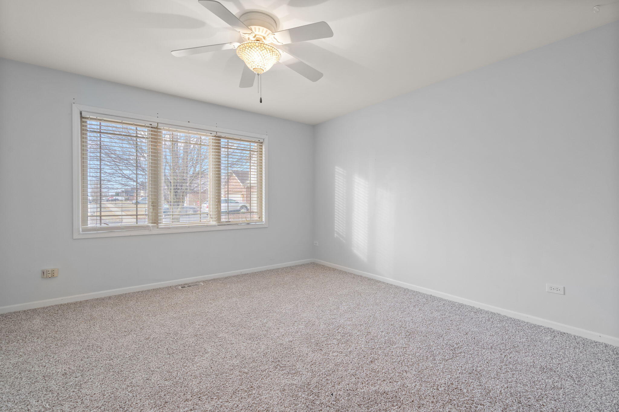 15976 97th Court Dyer, IN 46311 - Photo 24 of 29 an empty room with a window and a fan