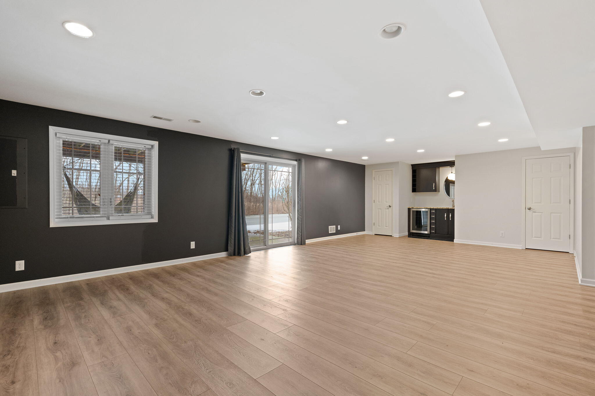15976 97th Court Dyer, IN 46311 - Photo 25 of 29 a view of an empty room with wooden floor and a window