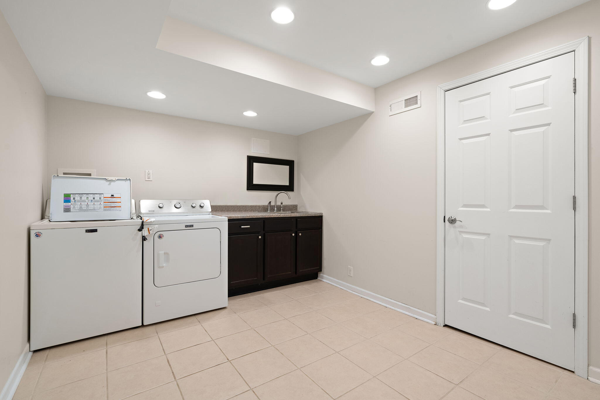 15976 97th Court Dyer, IN 46311 - Photo 27 of 29 a kitchen with a cabinets and white appliances