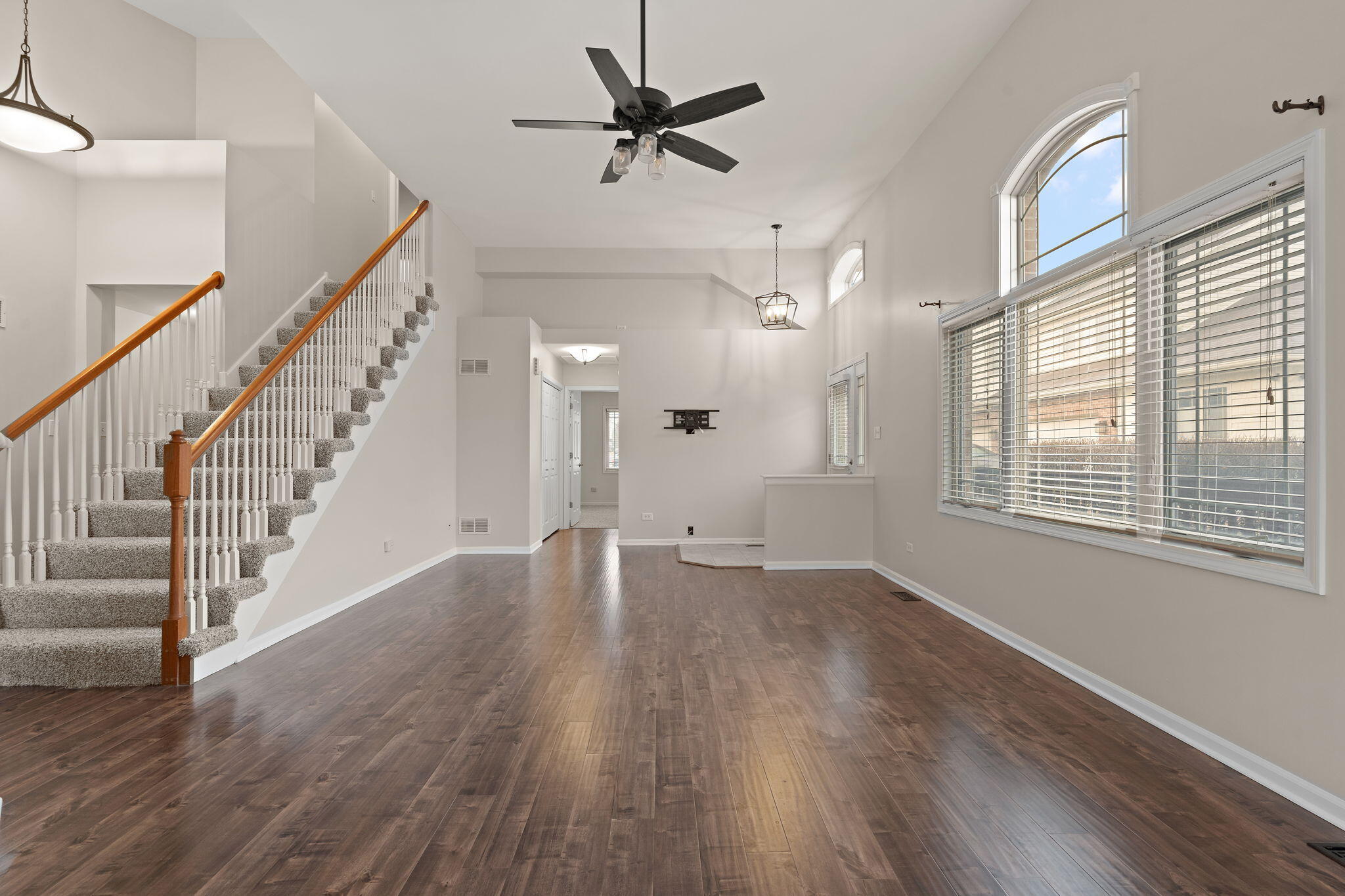 15976 97th Court Dyer, IN 46311 - Photo 5 of 29 a view of an empty room with wooden floor and a window