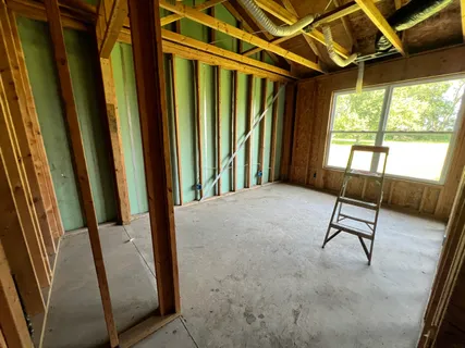 a view of a door with wooden floor