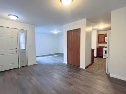 an empty room with wooden floor