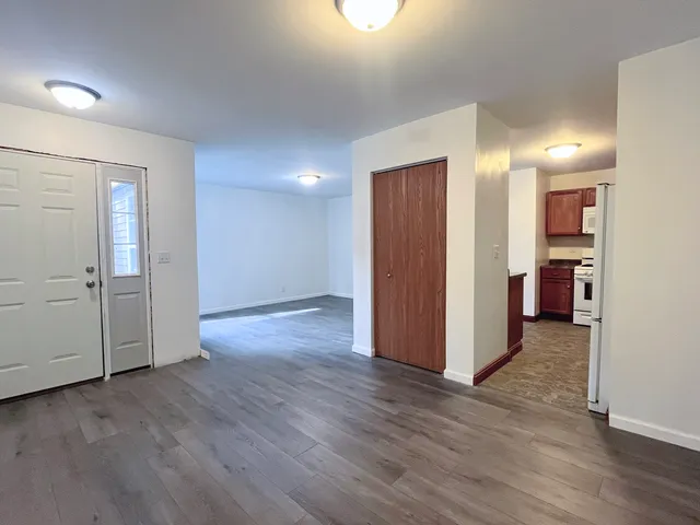 an empty room with wooden floor