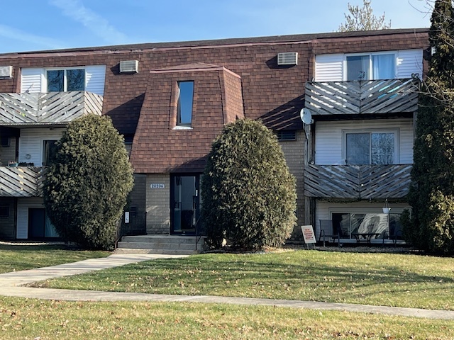 20206 South Frankfort Square Road, Unit K Frankfort, IL 60423 - Photo 1 of 30 a front view of a house with a garden