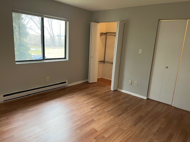 20206 South Frankfort Square Road, Unit K Frankfort, IL 60423 - Photo 12 of 30 a view of an empty room with wooden floor and a window