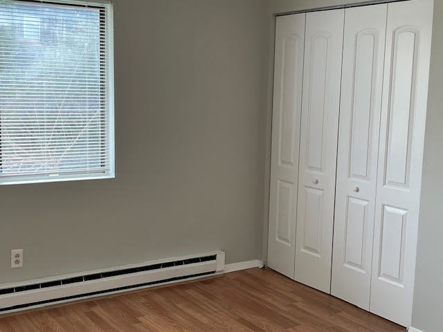 20206 South Frankfort Square Road, Unit K Frankfort, IL 60423 - Photo 13 of 30 a view of an empty room with wooden floor and a window