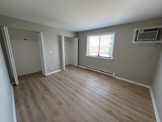 20206 South Frankfort Square Road, Unit K Frankfort, IL 60423 - Photo 18 of 30 a view of an empty room with wooden floor and a window