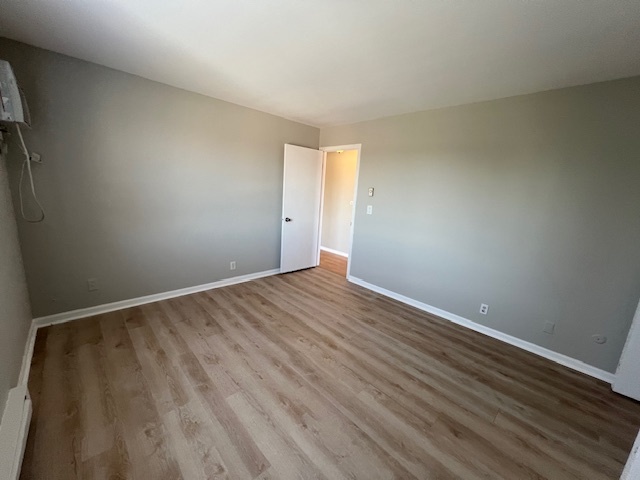 20206 South Frankfort Square Road, Unit K Frankfort, IL 60423 - Photo 20 of 30 a view of an empty room with wooden floor