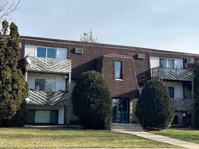 20206 South Frankfort Square Road, Unit K Frankfort, IL 60423 - Photo 2 of 30 a front view of a house with a garden
