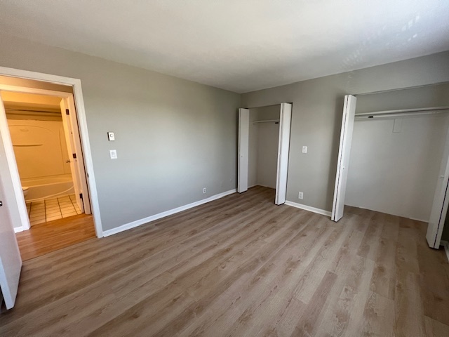 20206 South Frankfort Square Road, Unit K Frankfort, IL 60423 - Photo 21 of 30 a view of an empty room with wooden floor and a window
