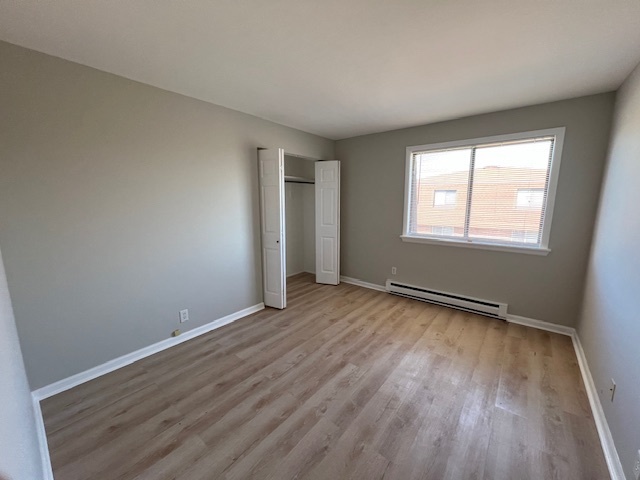 20206 South Frankfort Square Road, Unit K Frankfort, IL 60423 - Photo 22 of 30 an empty room with wooden floor and windows